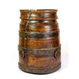 An 18th century metal strapped wooden vessel, H. 25cms.