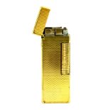 A gold plated Dunhill lighter, L. 6.5cms.