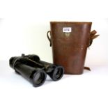 A pair of military binoculars with case.