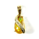 A 9ct yellow gold opal and diamond set pendant, L. 2cm.