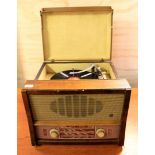 A 1950's portable radiogram by Ekco, Size 48 x 46 x 36cms.