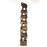 A carved African wooden tower of elephants, H.80cms.