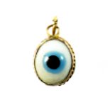 A yellow metal mounted evil eye pendant, L. 1.4cm.