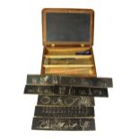 An Edwardian miniature lap desk with slate top and calligraphy instruction cards. Size 29 x 20cms.