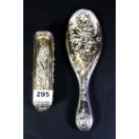 An Art Nouveau hallmarked silver brush and mirror. Mirror L. 25cms