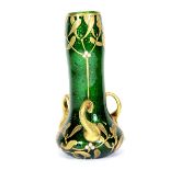 A Bohemian Art Nouveau green glass vase, with a gilt and jewelled overlaid decoration of