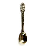 A heavy Art Nouveau hallmarked silver mustard spoon, L. 13cms.