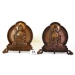 A pair of Tibetan hammered copper home shrine figures of a seated Buddha, H.17cms