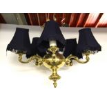 A heavy five branch brass light fitting, W. 50cms.