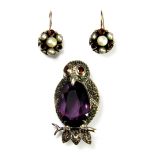 A 925 silver and marcasite owl shaped brooch set with amethyst and garnet, L. 4.5cm.