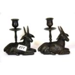 A pair of bronze goat candlesticks, H.15cms.