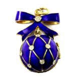A Faberge style enamelled gilt metal diamond set egg pendant, L. 3.5cm.