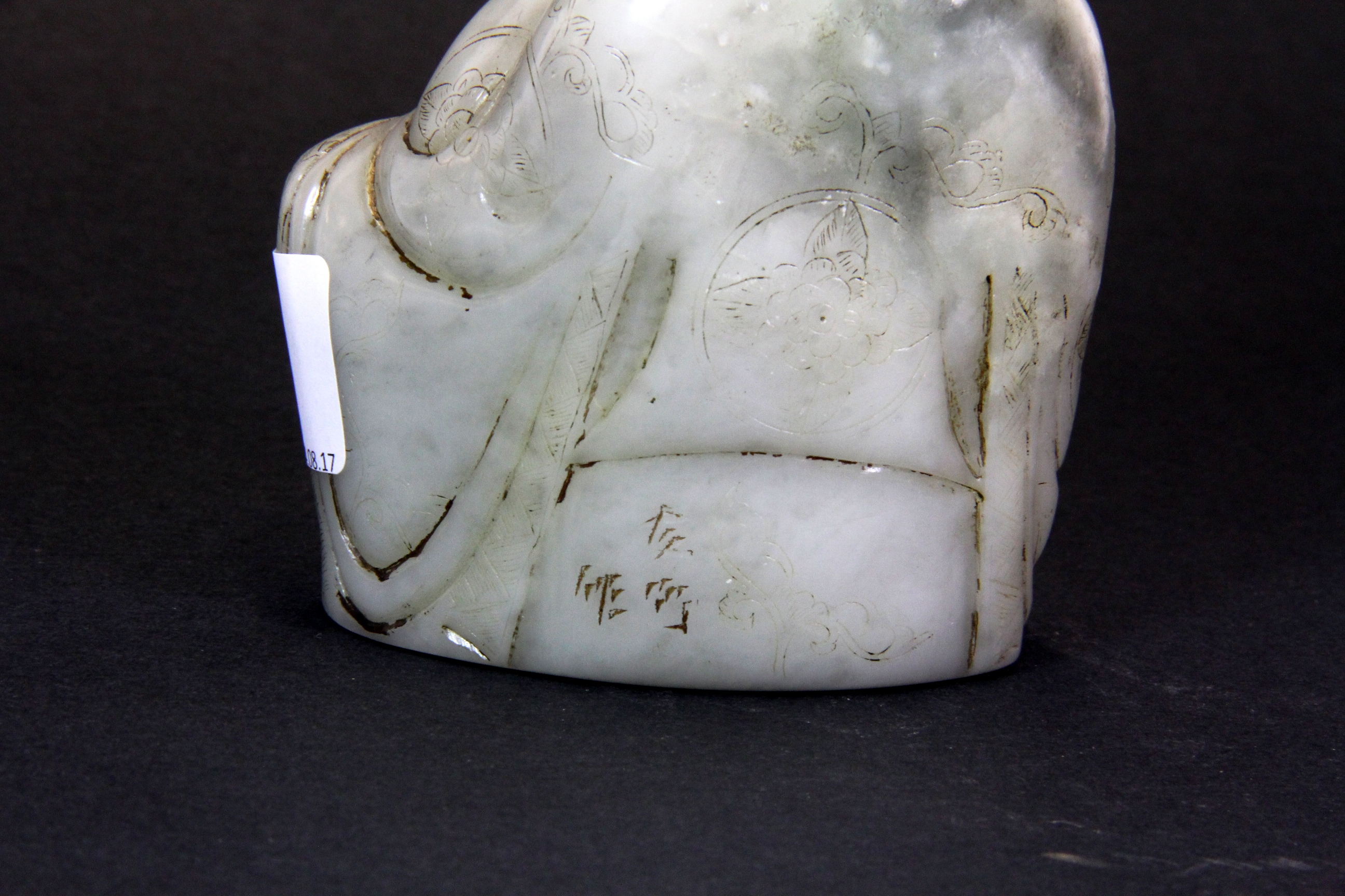 An interesting Chinese carved soapstone figural seal of a Lohan, H. 11.5cms. - Image 3 of 4