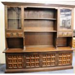 An oak display cabinet, W. 198cms H. 185cms.
