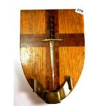 An interesting oak shield wall plaque, mounted with a dagger and engravings for German cities in