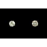 A pair of 10ct yellow gold (stamped 10k) diamond set stud earrings.