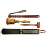 A collection of four interesting wooden items, including a trunchen, razor sharpener and two