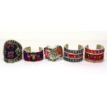 Five Chinese white metal and minority culture embroidery bangles, Widest. 9cms.