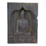 An old Himalayan carved wooden panel of a seated Buddha, H.28cms