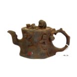An interesting Chinese cast iron tea pot, relief decorated with monkeys, H. 11cms, spout to