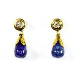 A pair of yellow metal (tested minimum 9ct gold) tanzanite and diamond set earrings.