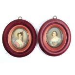 A pair of framed hand painted miniatures. Frame size 16.5 x 14.5cms