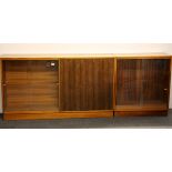 A 1970's teak bookcase cabinet (W. 136cm, H. 76cm), together with a further matching small