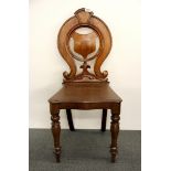 A Victorian mahogany hall chair.
