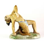 An unusual 19th century German porcelain figure of a monkey performing as a native dancer, H. 9.