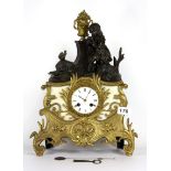 A mid 19th century French gilt spelter mantle clock with silk suspension, H. 40cm.