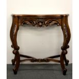 A carved mahogany console table, W. 80cm, H. 74cm.