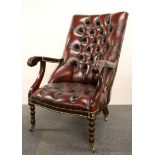 A leather upholstered mahogany arm chair.