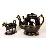 A rare 19th century double spout black glazed and gilt pottery teapot (H. 19cm, spout to handle