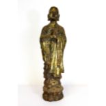 A Chinese gilt cast iron figure of a monk, H. 48cm.