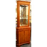 An attractive glazed corner cabinet.