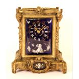 A lovely 19th century French bronze striking mantle clock with enamelled panels, H. 20cm.