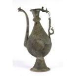 An early Persian hammered copper wine ewer, H. 45cm.