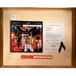 A framed record sleeve Queen Live Magic autographed by Freddy Mercury, 61 x 73cm.