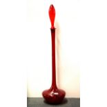 A 1970's tall red glass bottle and stopper, H. 99cm.