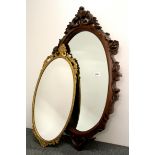 A carved mahogany mirror (H. 88cm) and a gilt mirror.