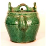 A 19th century Chinese green glazed pottery kettle, H. 21cm.