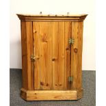 A small pine corner cabinet, H. 64cm.