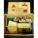 A box of mixed cigarette and tea cards.