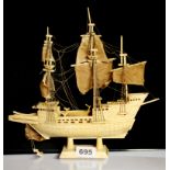 A carved bone model of a galleon, H. 28cm.