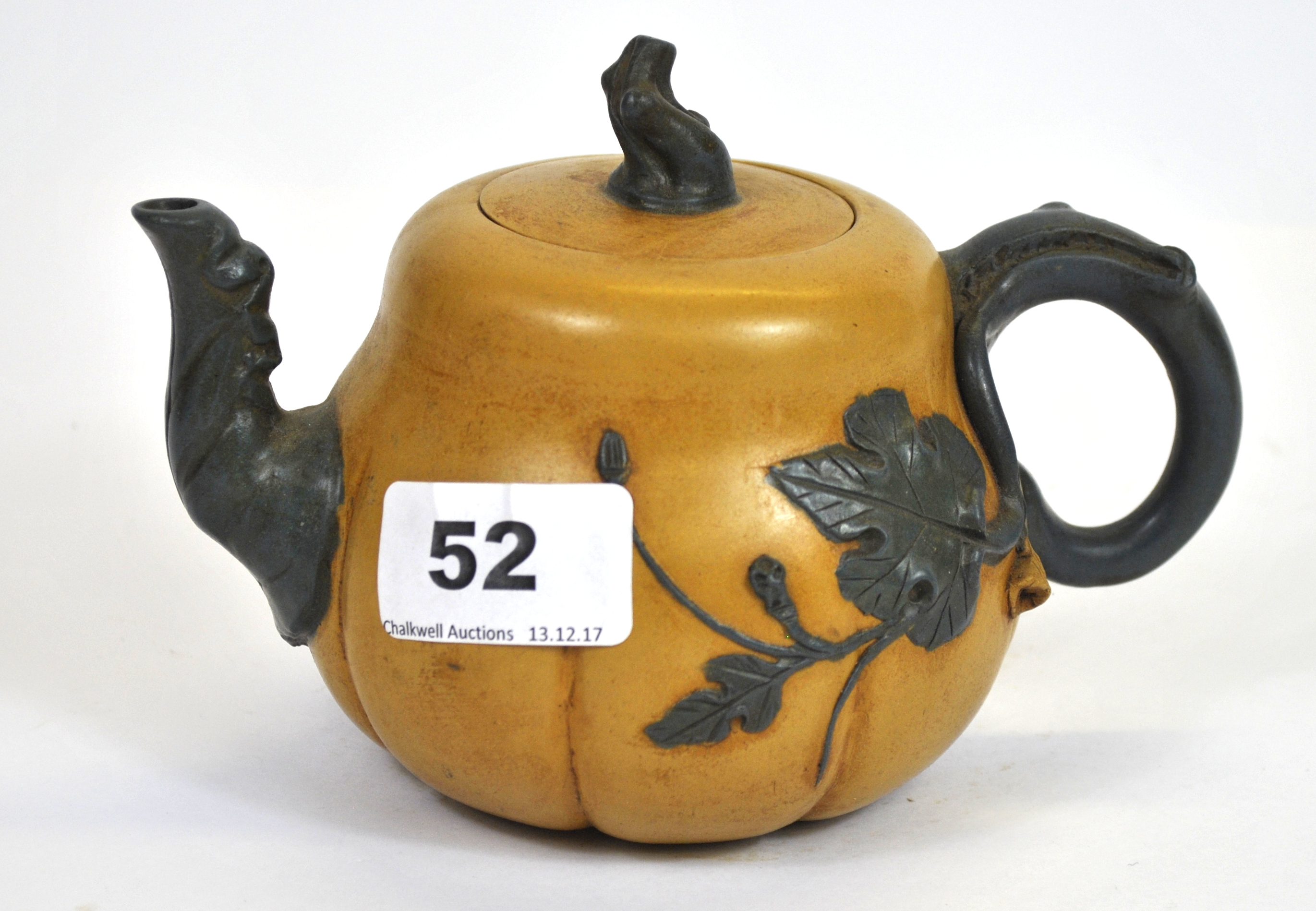 A Chinese two colour hand made Yixing terracotta tea pot, W. 19cm.