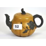 A Chinese two colour hand made Yixing terracotta tea pot, W. 19cm.