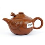 A Chinese handmade Yixing terracotta teapot with dragon decoration and articulated dragon head in