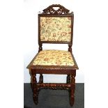 A 19th century carved hall chair.