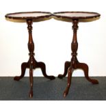 A pair of walnut veneered piecrust edge wine tables, Dia. 39cm, H. 64cm.