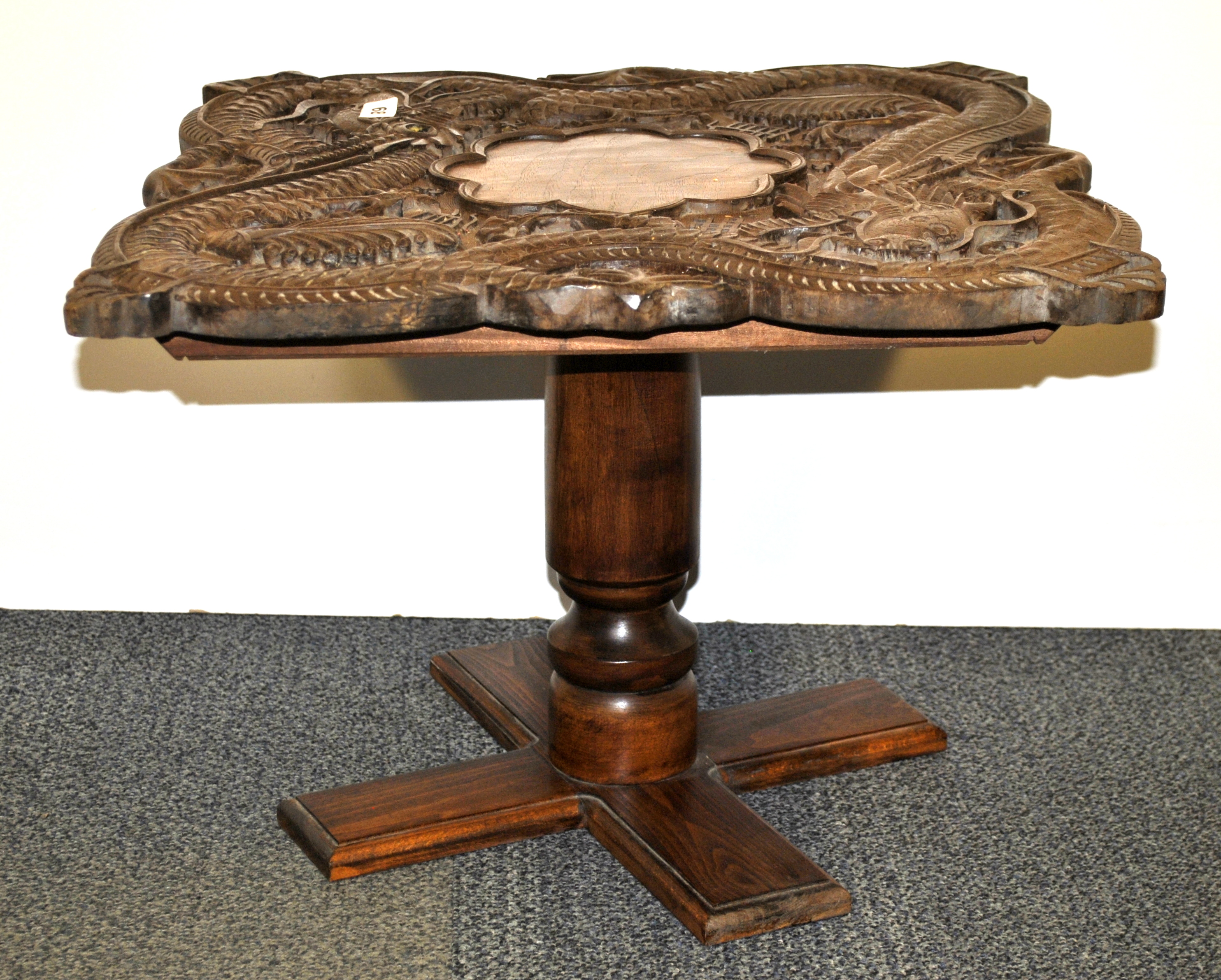 A mid 20th century Straits Chinese carved hardwood dragon table on a later base, 52 x 52 x 38cm.